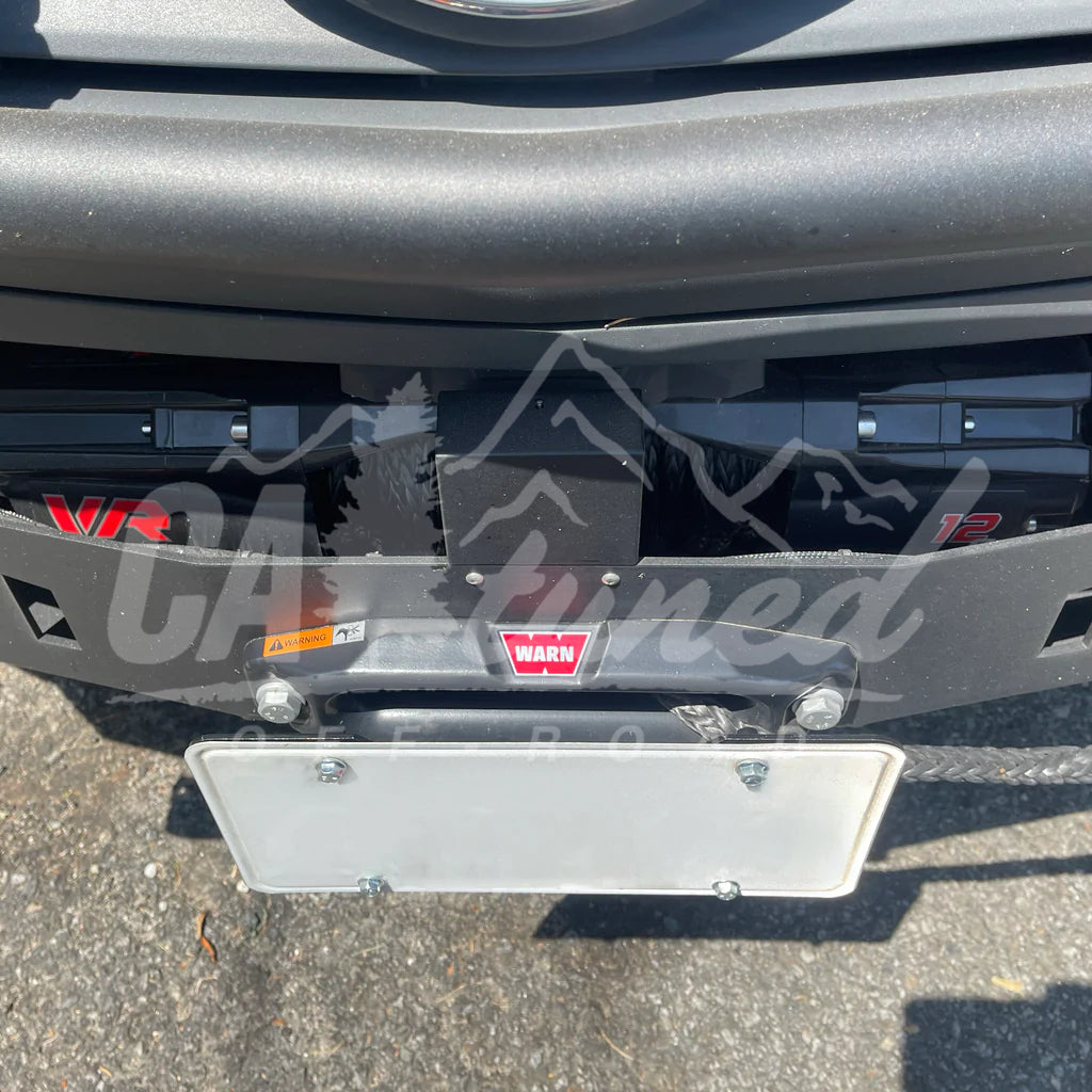 For those who live in states that require a front plate: ADF Customs tow  hook receiver kit, coupled with the Raceseng plate relocation kit and tug  shaft. : r/FocusST